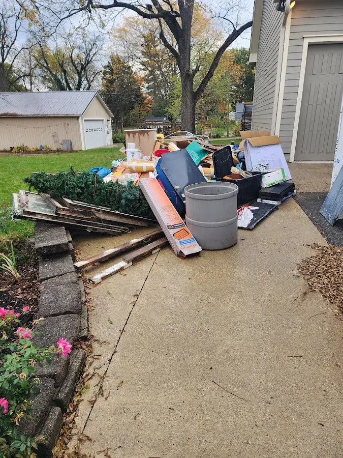 Dumpster being loaded with debris for 10 Yard Dumpster Rental in Frostproof